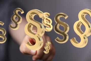 3D render of golden paragraph symbols, ideal for legal, law, and justice concepts.