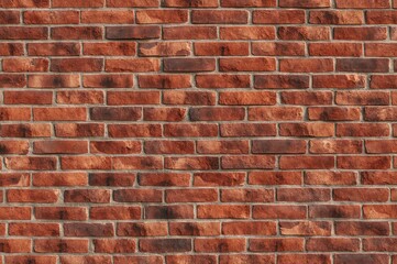 Obraz premium Wide view of textured red brick surface, ideal for interior and exterior design backgrounds