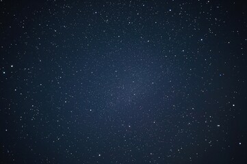 Obraz premium Nighttime cityscape beneath a star-filled sky