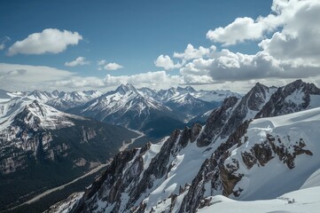 Obraz premium View from above of a beautiful snowy valley with rocky terrain beneath the sky