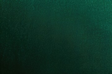 Gradient texture of dark green velvet fabric as backdrop