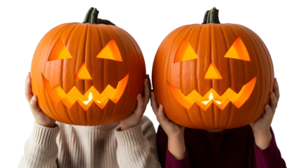 Two smiling jack-o-lanterns held up by unseen children, celebrating Halloween festivities with glowing faces against a white background