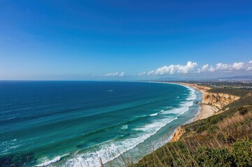 Clear skies and deep blue sea on a bright coastal day with space for text