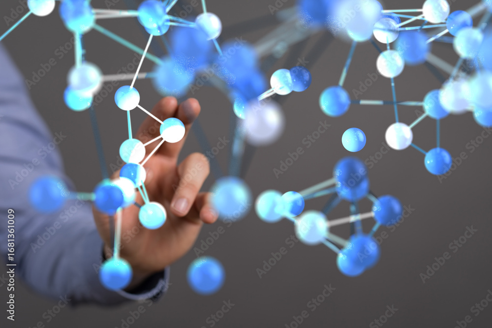 Poster abstract image of a person interacting with a 3d holographic model of a molecule.