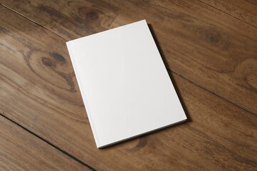 Empty brochure cover placed on wooden surface