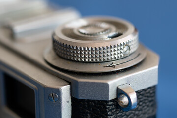 Film rewind lever on analogue camera close up, part of old camera