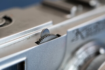 Focus gear on analog camera body close up, part of old camera