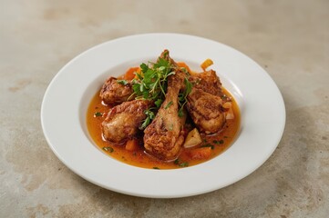 Fototapeta premium Crispy fried chicken served on a white dish, a favorite traditional Javanese meal