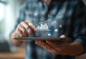 Hands holding tablet with projected growth graph