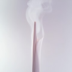 A close-up of a white paper, tapered object, emitting wispy white smoke against a pale lavender background.  The smoke curls and diffuses