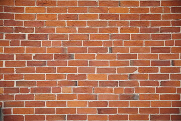 A brick wall with texture and straight lines.