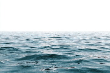 Naklejka premium Calm ocean water meets a bright white sky