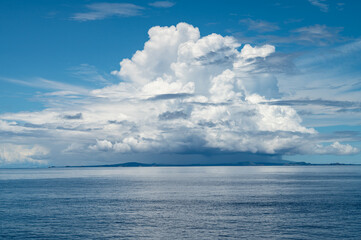Dramatic Cumulus Clouds Against Blue Sky Releases Rain over Galapagos Island