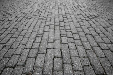Monochrome Gray Brick Stone Pathway from an Angle Showing Road Surface