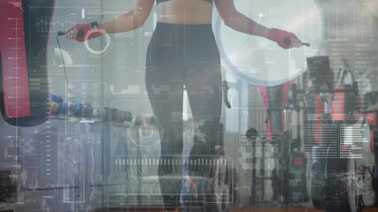 Animation of data processing over caucasian female boxer jumping rope at gym - Powered by Adobe