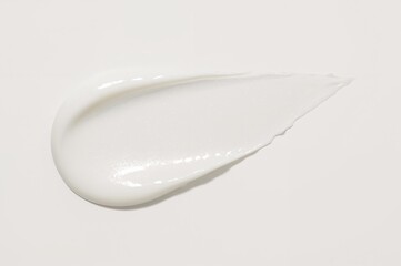 Swatch of white cosmetic cream on surface