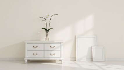 Room interior showing white storage unit with orchid and vacant picture frames beside the wall
