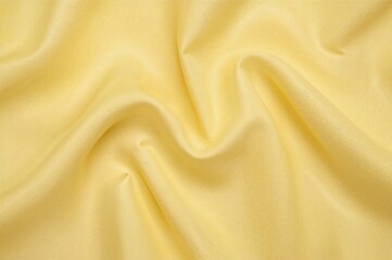 Obraz premium Abstract yellow textile with wavy cotton fabric texture