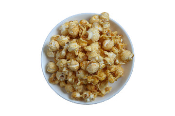 Top view of popcorn on white round plate isolated on transparent background.