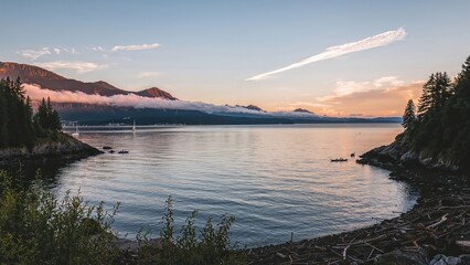 Fototapeta premium Travel Destination Featuring Sunset, Water, and Foggy Nature