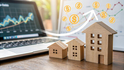 Wooden house models with financial graph on laptop screen and rising arrow with dollar symbols, representing real estate investment growth, property market success, and financial planning concept.