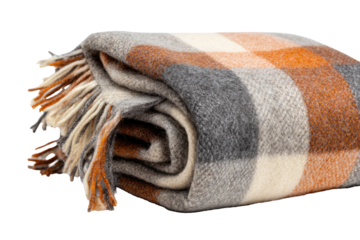 Folded plaid blanket, featuring a mix of orange, gray, and cream.  Fringed edges