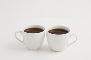 Two cups filled with beverage