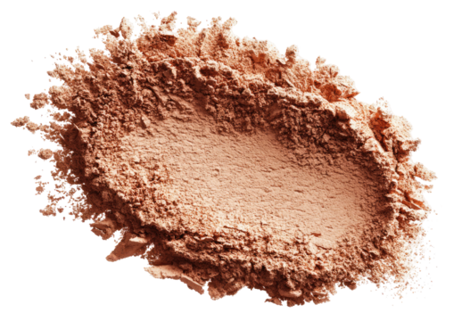 Light brown powder, slightly unevenly distributed, forming a rough oval shape, with a slightly splotchy appearance around the edges