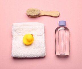 Baby bath accessories on pink background, flat lay