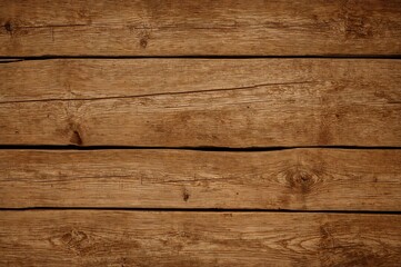 Naklejka premium Aged wooden surface featuring natural grain patterns and rustic charm. Ideal for backgrounds with space for text or artwork.