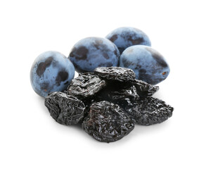Dried prunes and fresh plums isolated on white