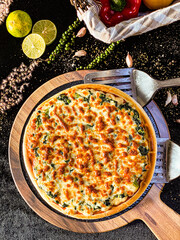 Delicious spinach cheese pizza with golden melted cheese and fresh green spinach topping.