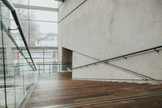 Modern interior of empty staircase with glass railing in hospital building