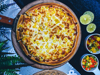 Delicious corn cheese pizza with golden melted cheese and sweet corn topping.