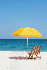 Umbrella and deck chair on the beach