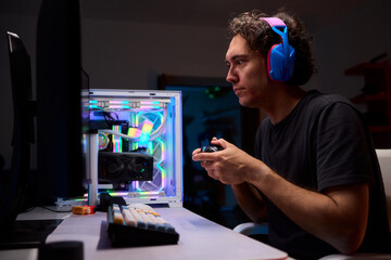 Enjoying an exciting gaming session with a controller and large screen for immersive gameplay