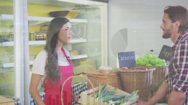 Animation of financial graphs over happy caucasian female seller and male customer in grocery shop - Powered by Adobe