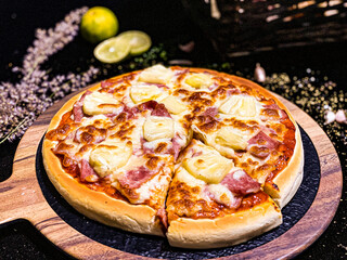 Hawaiian pizza topped with pineapple, bacon, and melted cheese, delicious and savory.