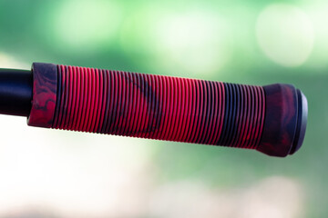 Red rubber scooter handle close up