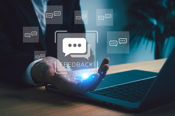Digital feedback. Businessman hand showing icon with comment bubbles, representing user review, communication technology, and interactive customer service concept.