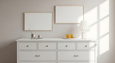 Modern bathroom vanity with two blank square picture frames on a neutral wall with natural light casting shadows