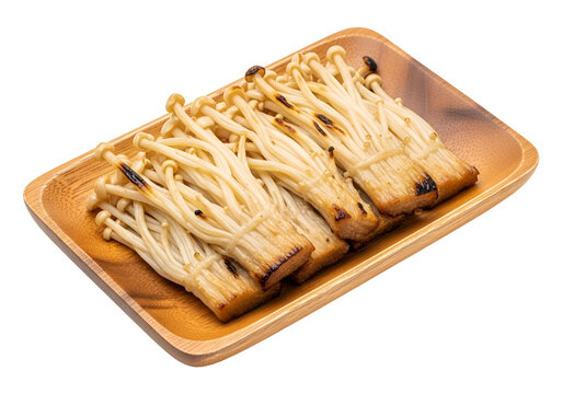 Roasted, clustered enoki mushrooms displayed on a light brown wooden rectangular plate against a black background.