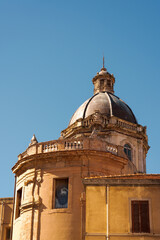 Old dome of historic church building under clear blue sky