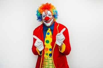 Clown pointing with both hands forward