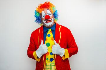 Clown making sad face with thumbs up