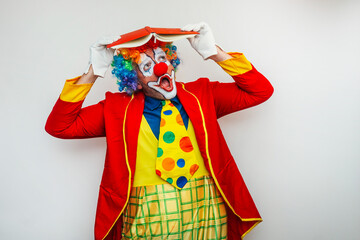 Clown with open book on head