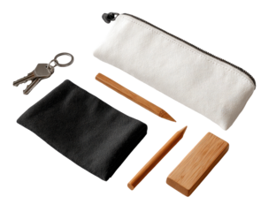 A flat lay of a white canvas pencil case, black cloth accessories, and various art supplies.  Keys are included