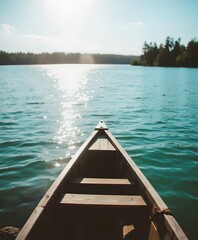 Naklejka premium Serene Canoe on Tranquil Lake Under a Bright Sky with Beautiful Reflection