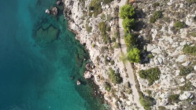 Aerial Mediterranean Sea top down near Paralia Arvantias beach mountains winter day Nafplio
