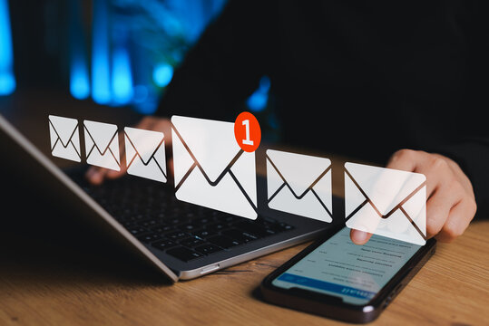 New Email Notification Concept. Person checking inbox smartphone and laptop with envelope icons representing new email notifications, communication, mail alert, digital marketing and connectivity.